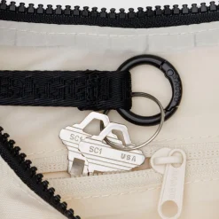 Small Nylon Crescent Bag in Embroidered Shells by Baggu