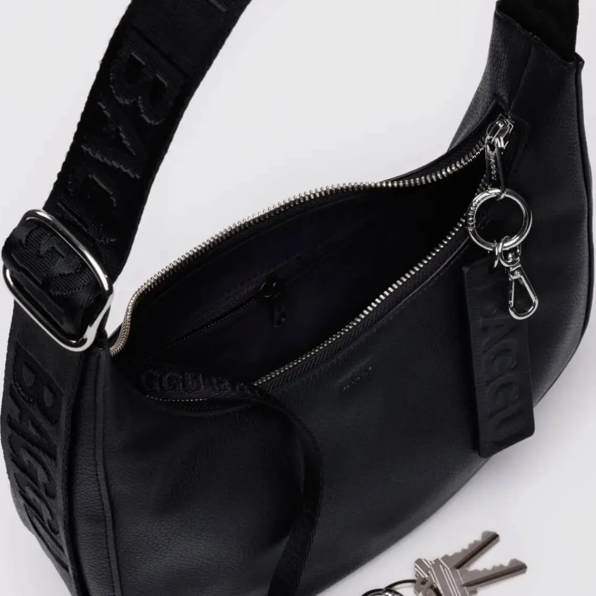 Small Recycled Leather Crescent Bag in Black by Baggu
