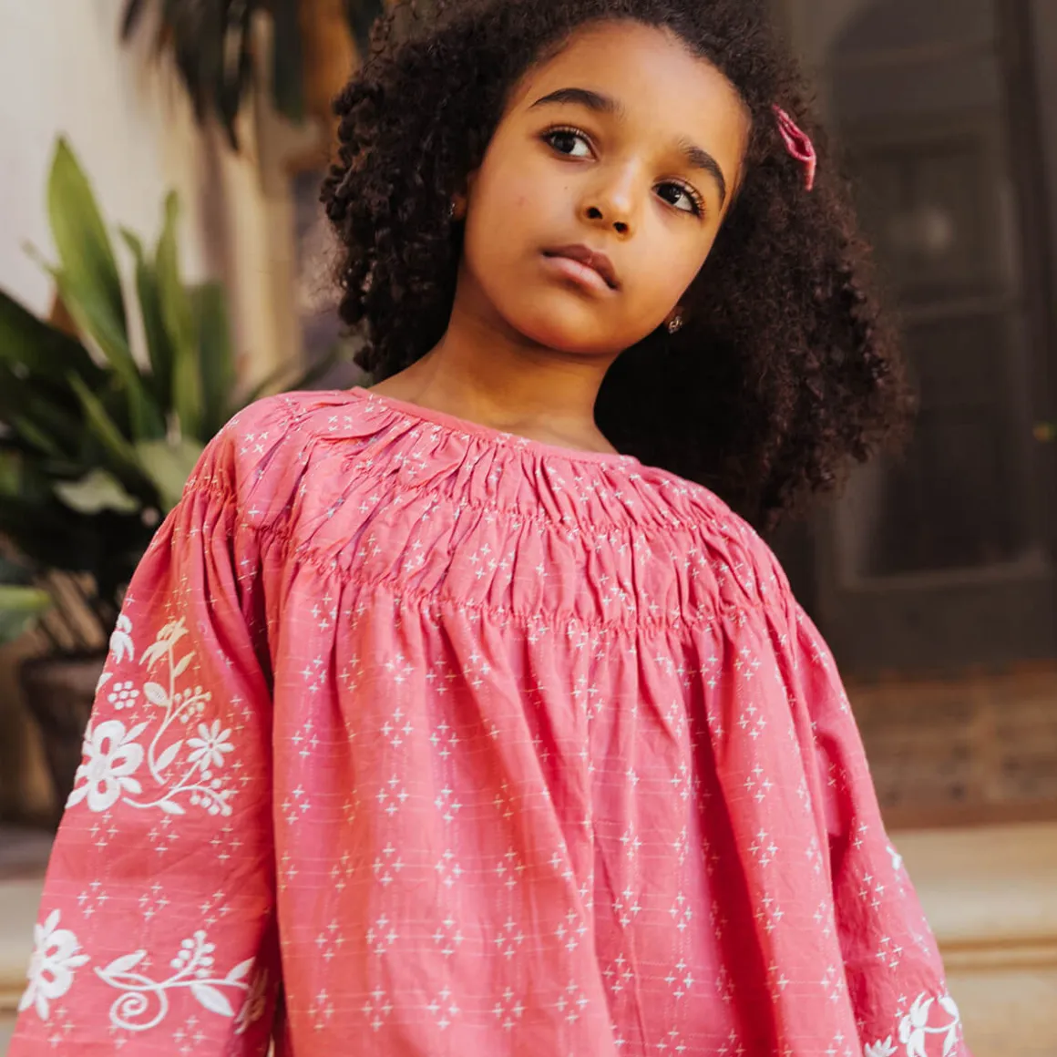 Tulip Pintuck Dress in Coral Cross Stitch by Lali