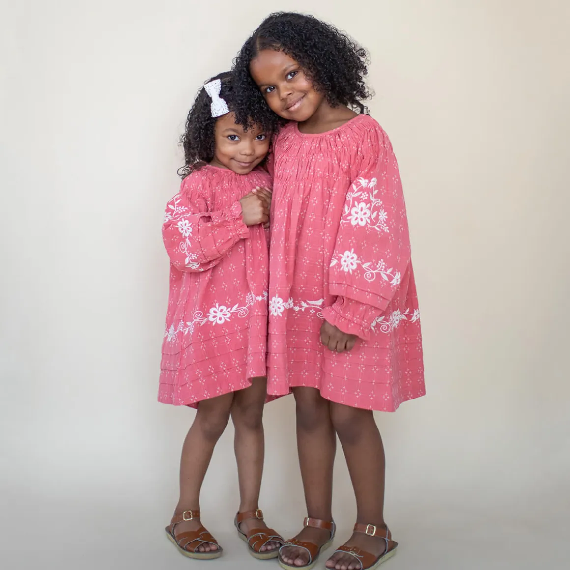 Tulip Pintuck Dress in Coral Cross Stitch by Lali